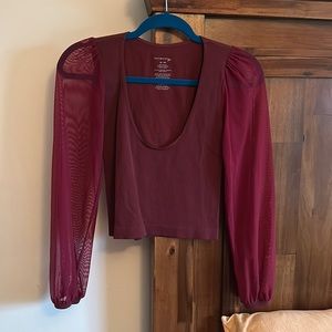 Free People’s “Lost in Love” Top with Mesh Sleeves